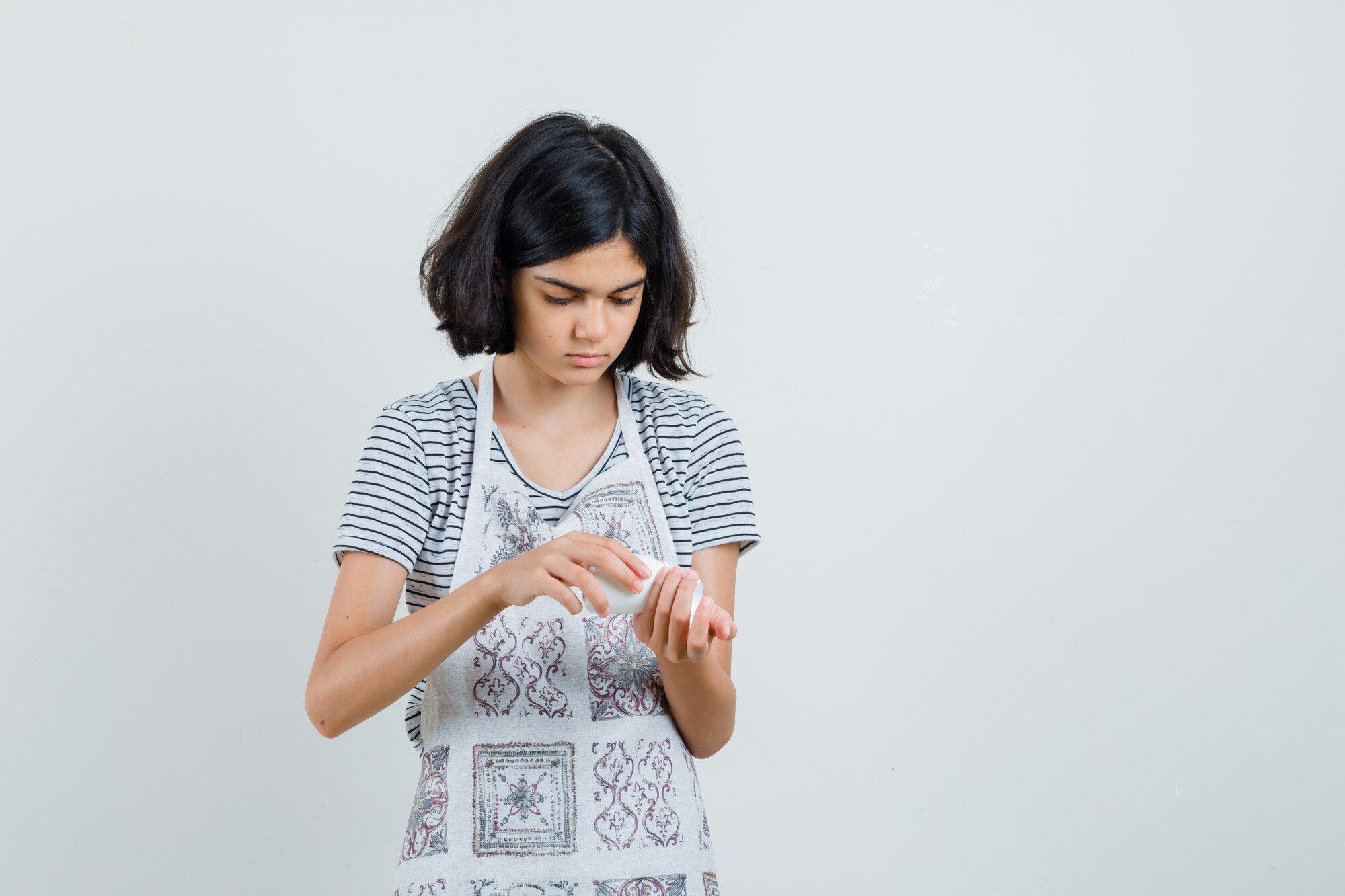 Artisan soapmaker formulating botanical cold-process bars in studio